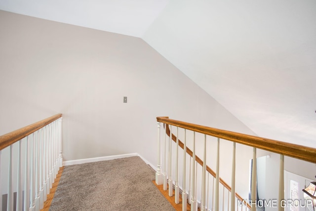 2103 Woodlark Dr, Holland, MI 49424 - hallway featuring lofted ceiling, an upstairs landing, and baseboards