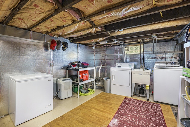 18422 Merriman Rd, Romulus, MI 48174 - below grade area featuring washer and dryer, white refrigerator, and a sink
