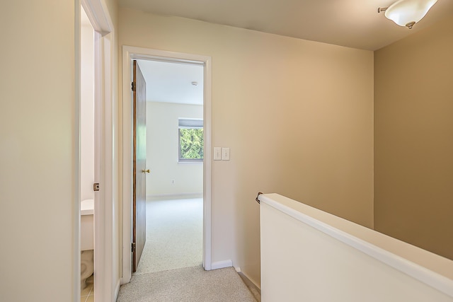 2503 Meade Ct, Ann Arbor, MI 48105 - hall with an upstairs landing, light colored carpet, and baseboards