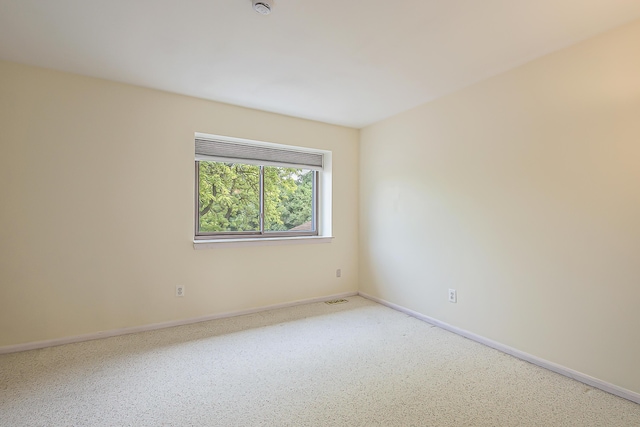 2503 Meade Ct, Ann Arbor, MI 48105 - spare room featuring baseboards and a smoke detector