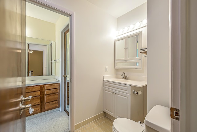 2503 Meade Ct, Ann Arbor, MI 48105 - half bath with toilet, vanity, baseboards, and tile patterned floors