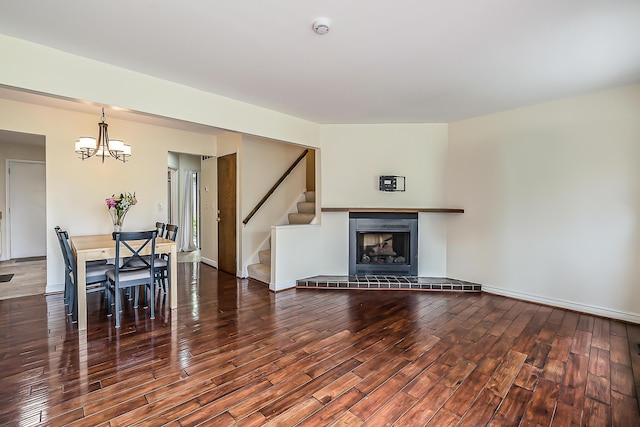 2503 Meade Ct, Ann Arbor, MI 48105 - living room featuring wood finished floors, stairs, a chandelier, and a fireplace