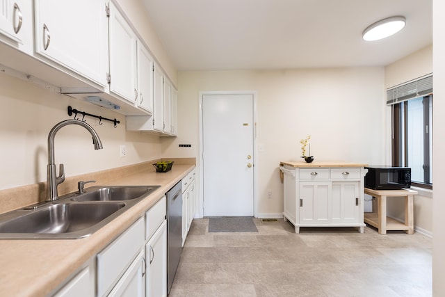 2503 Meade Ct, Ann Arbor, MI 48105 - kitchen with a sink, white cabinetry, and light countertops