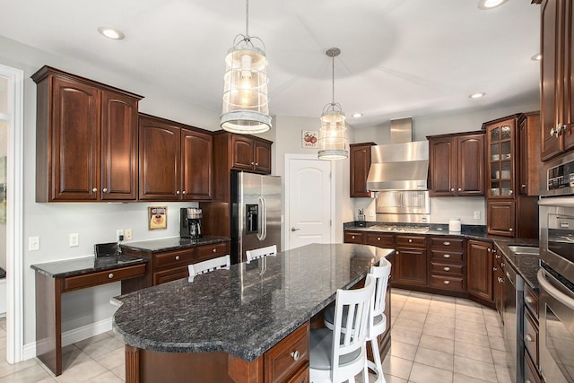 7251 Beverly Dr, South Haven, MI 49090 - kitchen featuring stainless steel appliances, wall chimney exhaust hood, a center island, light tile patterned floors, and pendant lighting