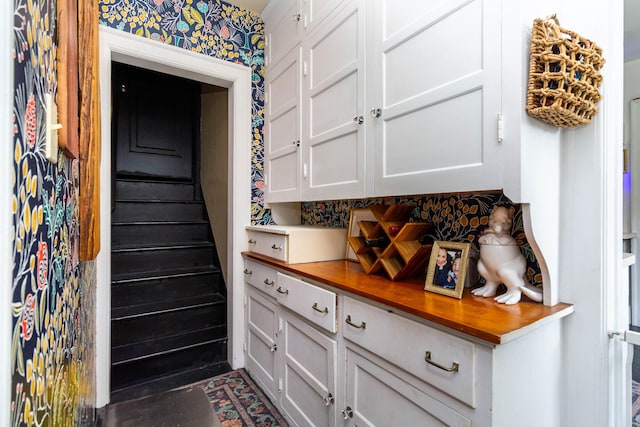 953 Berkshire Rd, Grosse Pointe Park, MI 48230 - kitchen with butcher block countertops, tasteful backsplash, and white cabinets