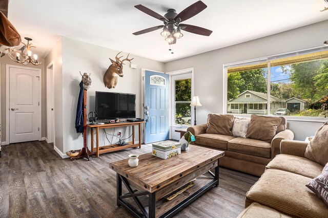 84 Eldred St, Battle Creek, MI 49015 - living room featuring wood finished floors, baseboards, a chandelier, and ceiling fan