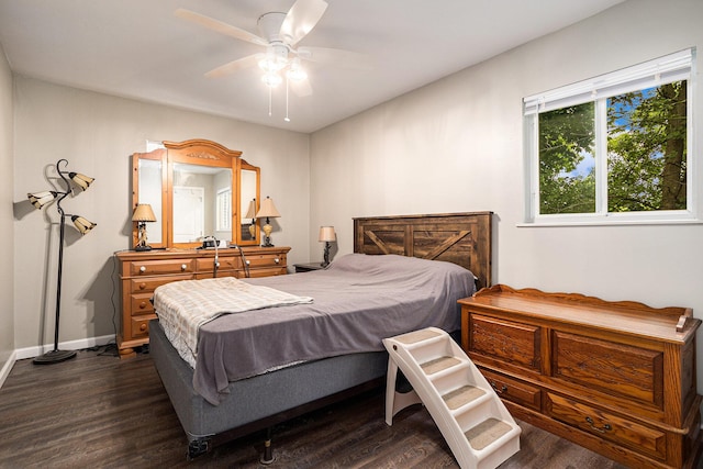84 Eldred St, Battle Creek, MI 49015 - bedroom with dark wood-style flooring, ceiling fan, and baseboards
