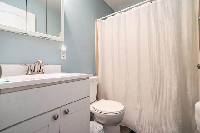 84 Eldred St, Battle Creek, MI 49015 - bathroom with toilet, vanity, and a shower with shower curtain