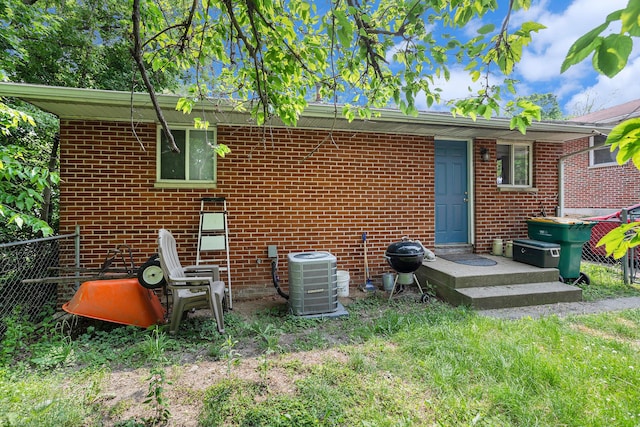 84 Eldred St, Battle Creek, MI 49015 - back of property featuring central AC and brick siding