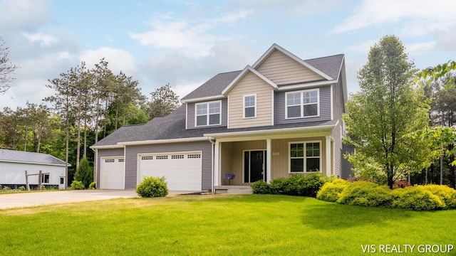 9340 Freedom Dr, West Olive, MI 49460 - view of front facade with driveway, a front lawn, covered porch, an attached garage, and board and batten siding