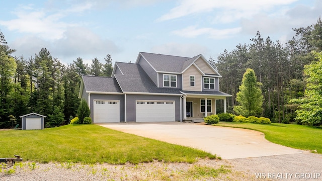 9340 Freedom Dr, West Olive, MI 49460 - view of front of home with covered porch, driveway, an attached garage, and a front yard