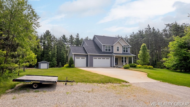 9340 Freedom Dr, West Olive, MI 49460 - view of front of property with a front lawn, a garage, and driveway