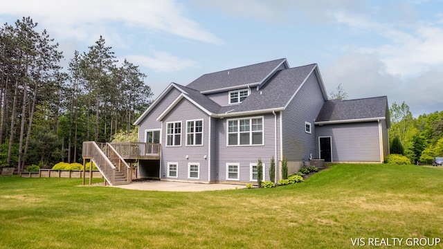 9340 Freedom Dr, West Olive, MI 49460 - rear view of house featuring a patio, stairway, a deck, and a lawn