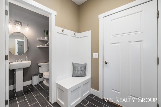 9340 Freedom Dr, West Olive, MI 49460 - mudroom featuring baseboards and a sink
