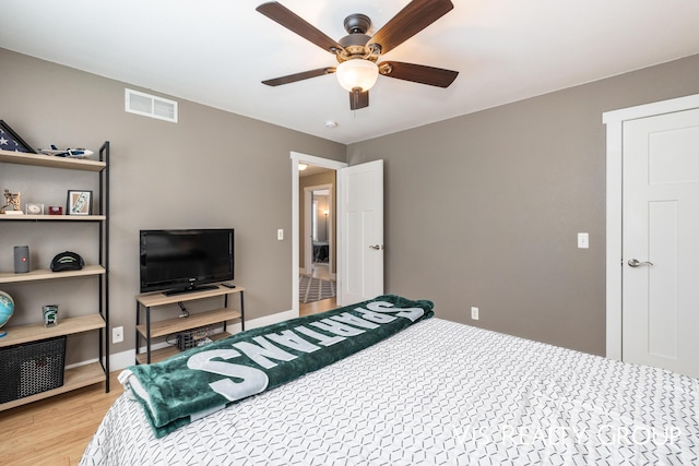 9340 Freedom Dr, West Olive, MI 49460 - bedroom featuring light wood-type flooring and a ceiling fan