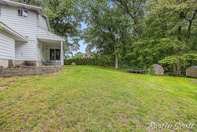 310 Brookgate Ct NW, Comstock Park, MI 49321 - view of green lawn with a trampoline