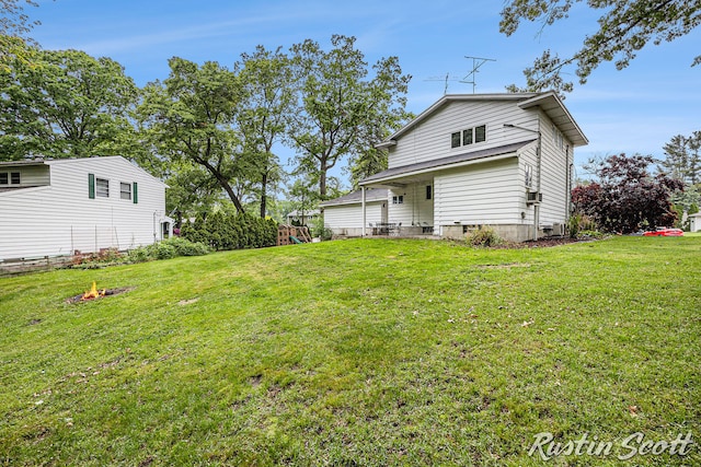 310 Brookgate Ct NW, Comstock Park, MI 49321 - back of property with a lawn and a playground