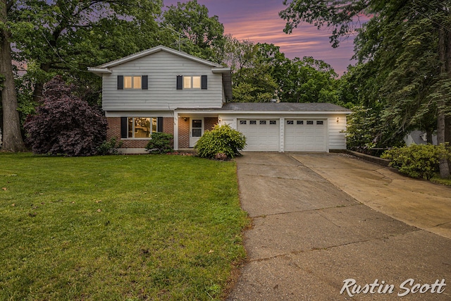 310 Brookgate Ct NW, Comstock Park, MI 49321 - traditional-style house with an attached garage, concrete driveway, brick siding, and a front yard
