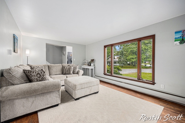 310 Brookgate Ct NW, Comstock Park, MI 49321 - living area with a baseboard heating unit and wood finished floors