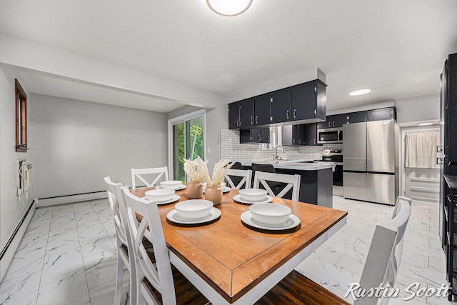 310 Brookgate Ct NW, Comstock Park, MI 49321 - dining room featuring light marble finish floors, a baseboard heating unit, baseboards, recessed lighting, and baseboard heating
