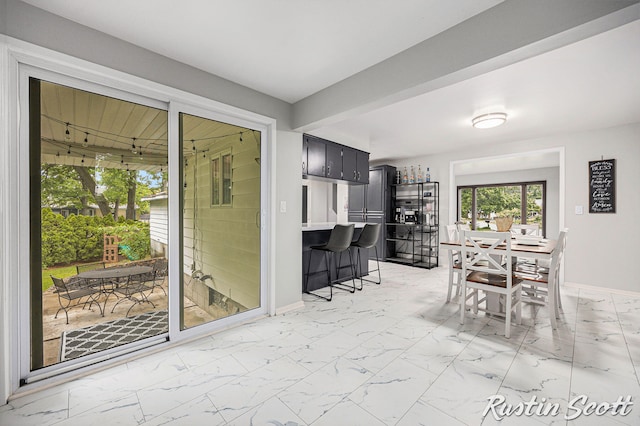 310 Brookgate Ct NW, Comstock Park, MI 49321 - dining space with light marble finish flooring and baseboards