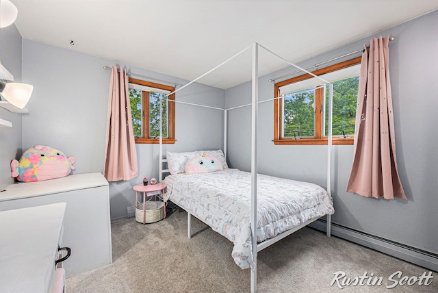 310 Brookgate Ct NW, Comstock Park, MI 49321 - carpeted bedroom with baseboard heating and multiple windows