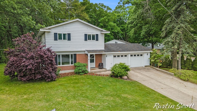 310 Brookgate Ct NW, Comstock Park, MI 49321 - traditional-style home featuring an attached garage, concrete driveway, a front lawn, and brick siding