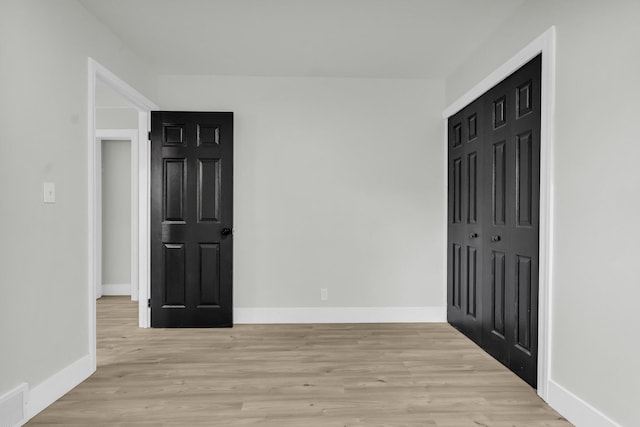 20504 Cherrylawn St, Detroit, MI 48221 - unfurnished bedroom featuring light wood-style flooring, baseboards, and a closet