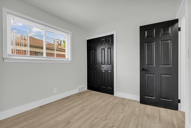 20504 Cherrylawn St, Detroit, MI 48221 - unfurnished bedroom featuring baseboards, light wood finished floors, and a closet