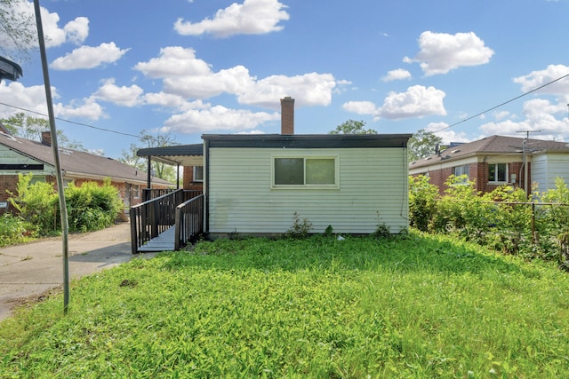 20504 Cherrylawn St, Detroit, MI 48221 - back of house featuring a chimney