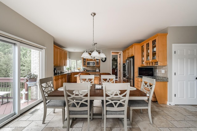 71 Knorrwood Dr, Rochester Hills, MI 48306 - dining room with stone tile flooring and a chandelier