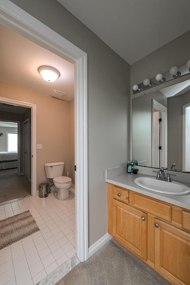 71 Knorrwood Dr, Rochester Hills, MI 48306 - bathroom with vanity, toilet, tile patterned flooring, and baseboards