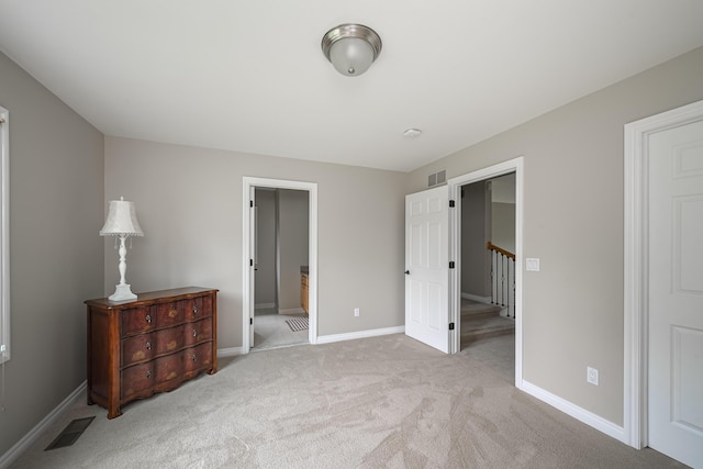 71 Knorrwood Dr, Rochester Hills, MI 48306 - unfurnished bedroom with carpet, baseboards, a spacious closet, ensuite bathroom, and a closet