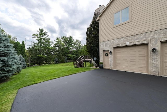 71 Knorrwood Dr, Rochester Hills, MI 48306 - garage with asphalt driveway