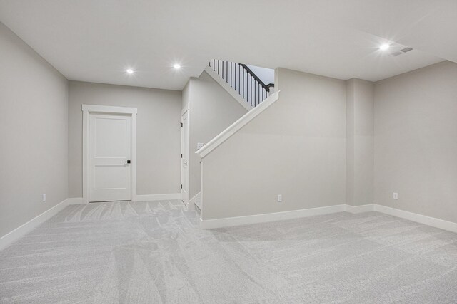 2740 Woodhaven Ct SW Unit 02, Byron Center, MI 49315 - basement featuring recessed lighting, light carpet, stairway, and baseboards