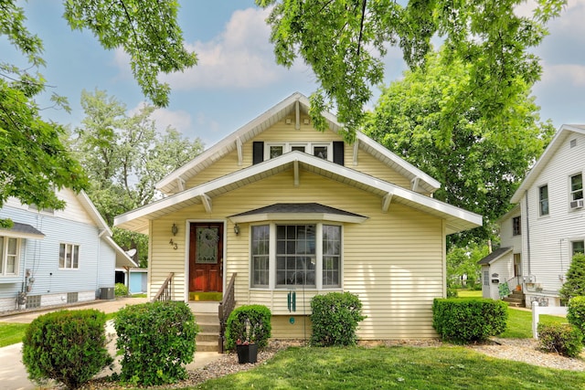 43 W Cherry Ave, Zeeland, MI 49464 - view of front of property with a front lawn and central air condition unit
