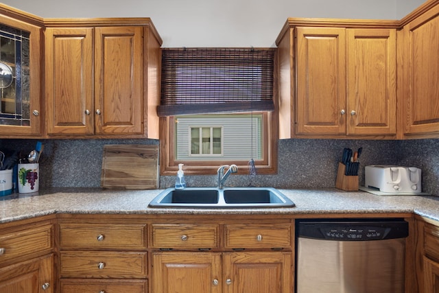 43 W Cherry Ave, Zeeland, MI 49464 - kitchen featuring dishwasher, a sink, brown cabinets, backsplash, and glass insert cabinets