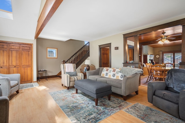 43 W Cherry Ave, Zeeland, MI 49464 - living area with stairway, light wood-style floors, ceiling fan, and baseboards
