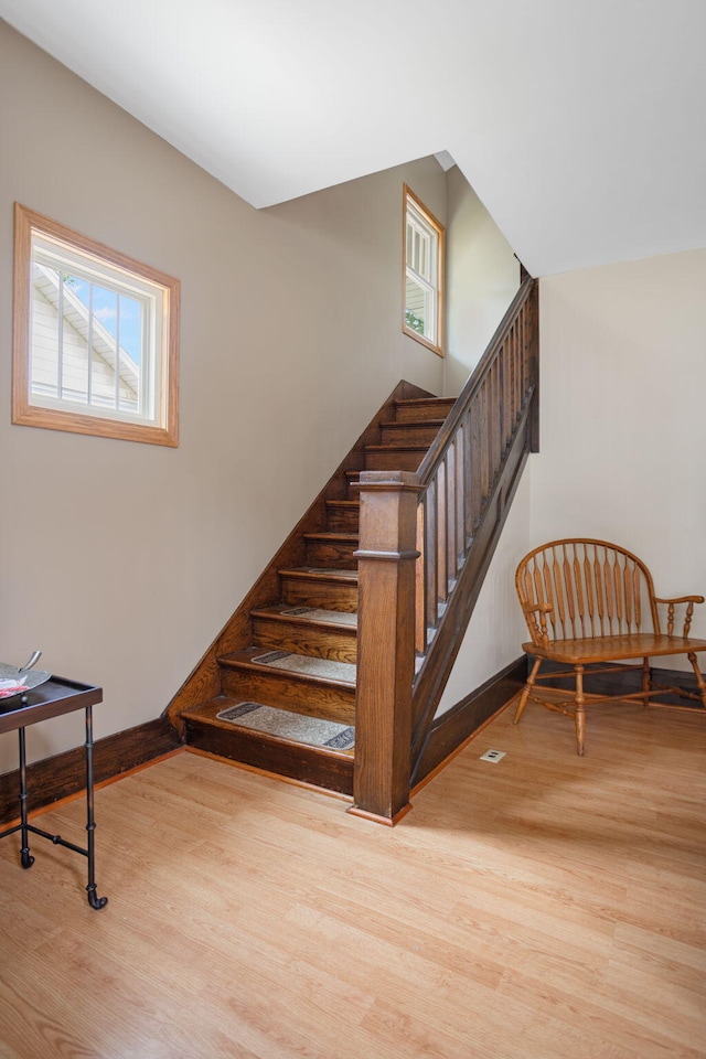 43 W Cherry Ave, Zeeland, MI 49464 - stairs featuring wood finished floors and baseboards