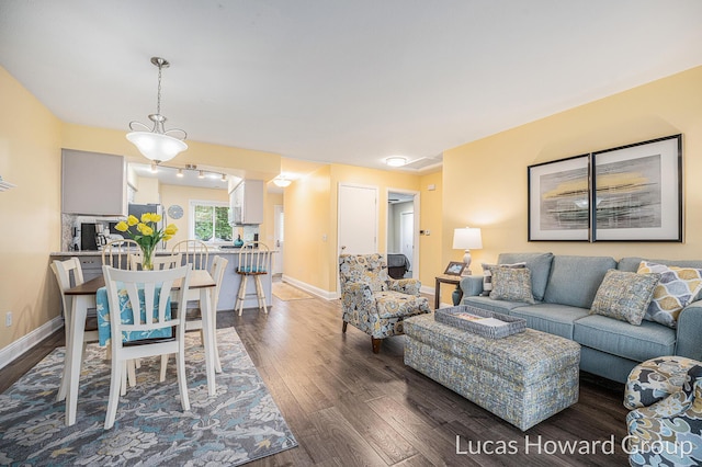 5228 Green Meadow Rd, Kalamazoo, MI 49009 - living room with dark wood-type flooring and baseboards