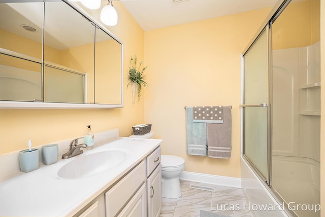 5228 Green Meadow Rd, Kalamazoo, MI 49009 - full bath featuring vanity, marble look tiles, toilet, combined bath / shower with glass door, and baseboards