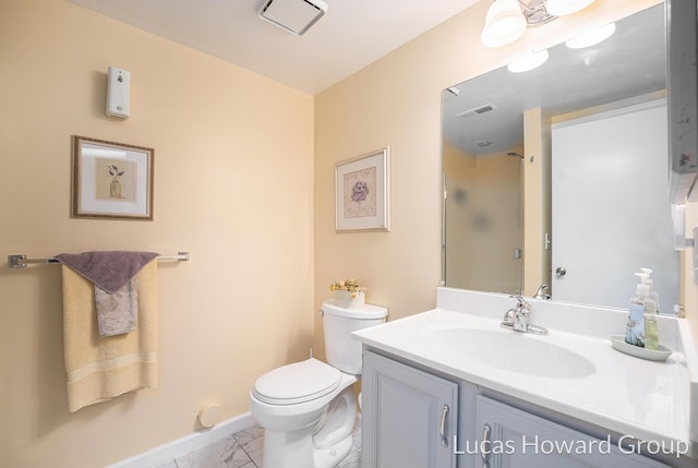 5228 Green Meadow Rd, Kalamazoo, MI 49009 - full bath with toilet, vanity, marble look tile flooring, a shower, and baseboards