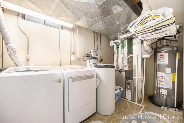 5228 Green Meadow Rd, Kalamazoo, MI 49009 - laundry area with gas water heater, independent washer and dryer, and heating unit
