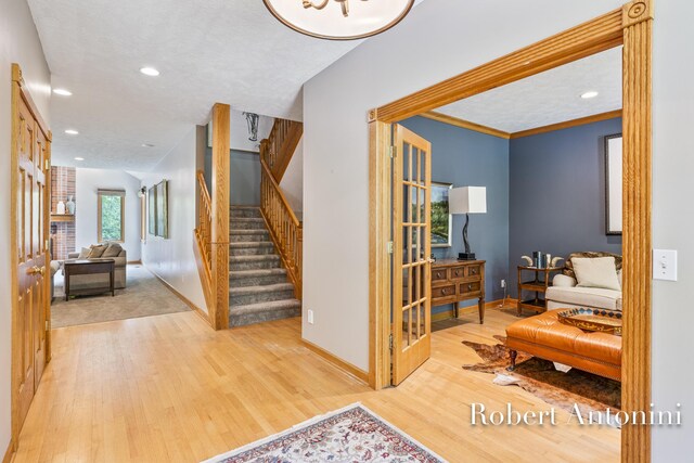 6374 Blakely Dr NE, Rockford, MI 49341 - foyer entrance featuring stairs, wood finished floors, baseboards, and recessed lighting