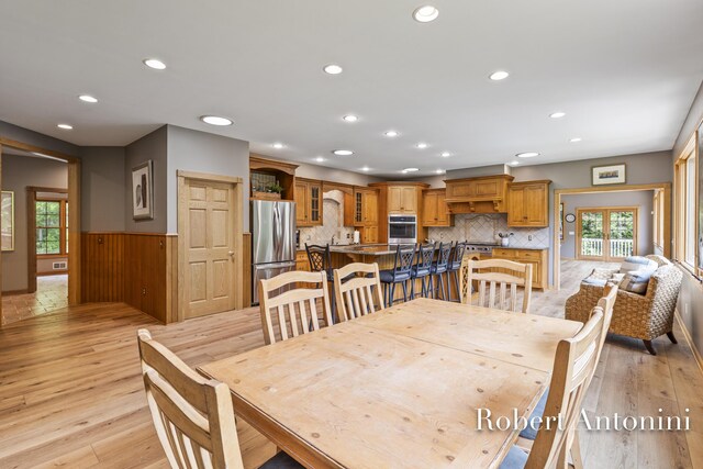 6374 Blakely Dr NE, Rockford, MI 49341 - dining room featuring wainscoting, recessed lighting, and light wood-style flooring