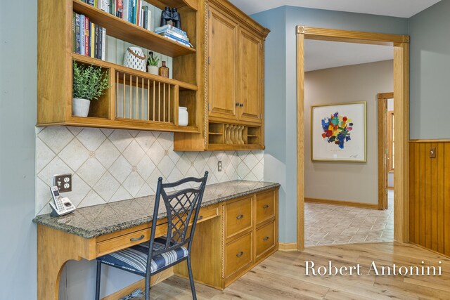 6374 Blakely Dr NE, Rockford, MI 49341 - kitchen with open shelves, tasteful backsplash, light wood-type flooring, brown cabinets, and baseboards