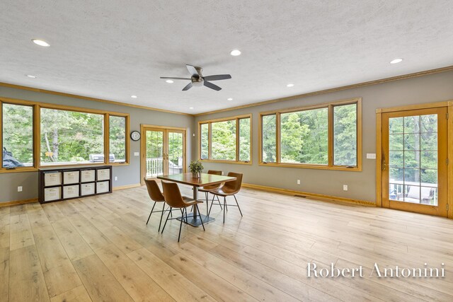 6374 Blakely Dr NE, Rockford, MI 49341 - dining space featuring crown molding, baseboards, recessed lighting, ceiling fan, and light wood finished floors