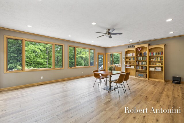 6374 Blakely Dr NE, Rockford, MI 49341 - dining space featuring crown molding, recessed lighting, a ceiling fan, wood finished floors, and baseboards