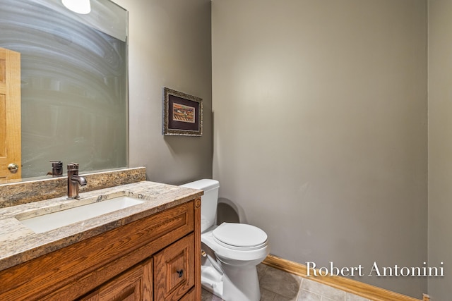 6374 Blakely Dr NE, Rockford, MI 49341 - half bath with toilet, tile patterned flooring, vanity, and baseboards