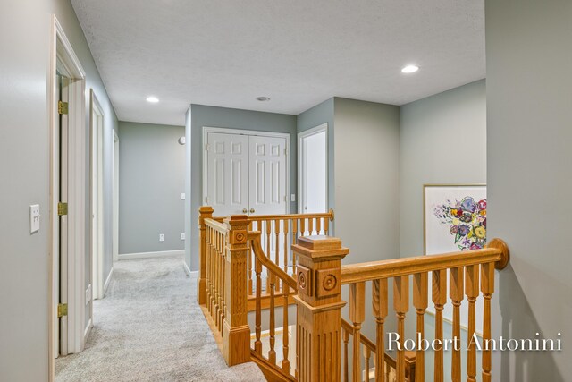 6374 Blakely Dr NE, Rockford, MI 49341 - corridor featuring an upstairs landing, carpet, baseboards, and recessed lighting
